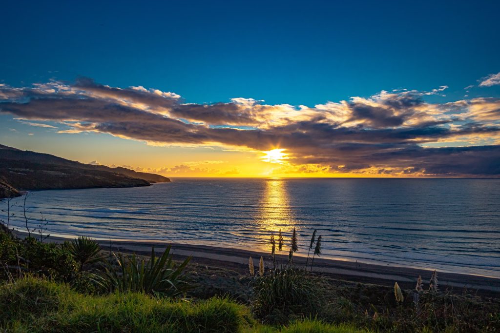 ngaranui beach at sunset, raglan