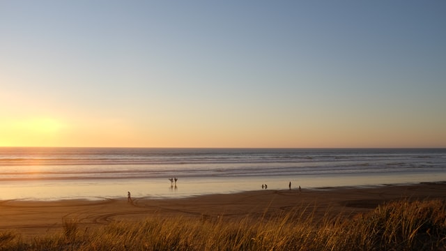 sunset at ninety mile beach, northland