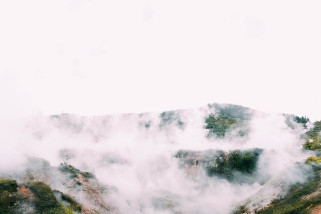 geothermal steam rising from the ground