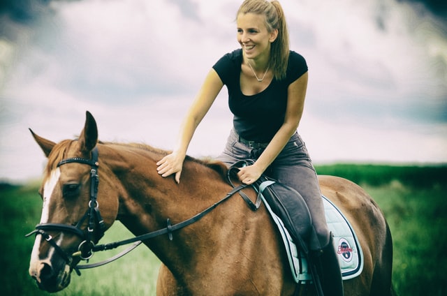 woman riding a horse