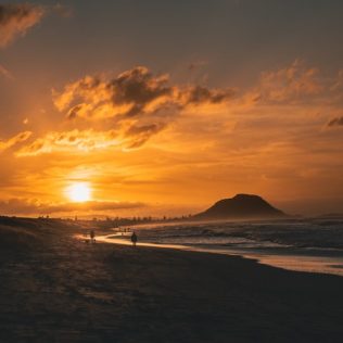 sunset over beach in mount maunganui