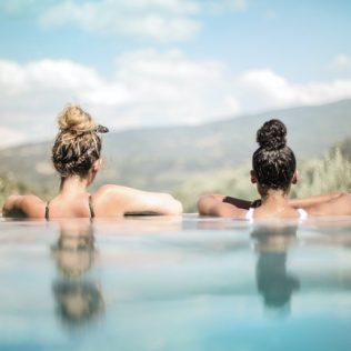 two woman in a pool