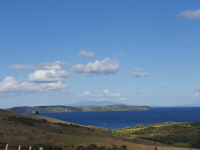 view of green hills and sea