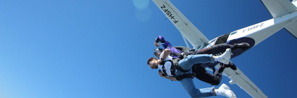 two people jumping out of plane