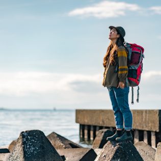 female traveller by the sea